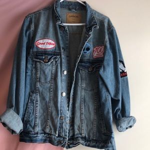 Men’s denim jacket with patches.